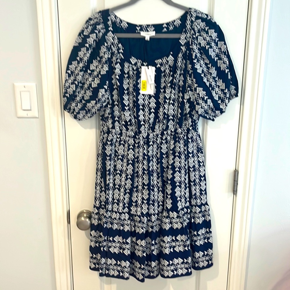 A loves a a navy and white mini dress with puffed sleeves